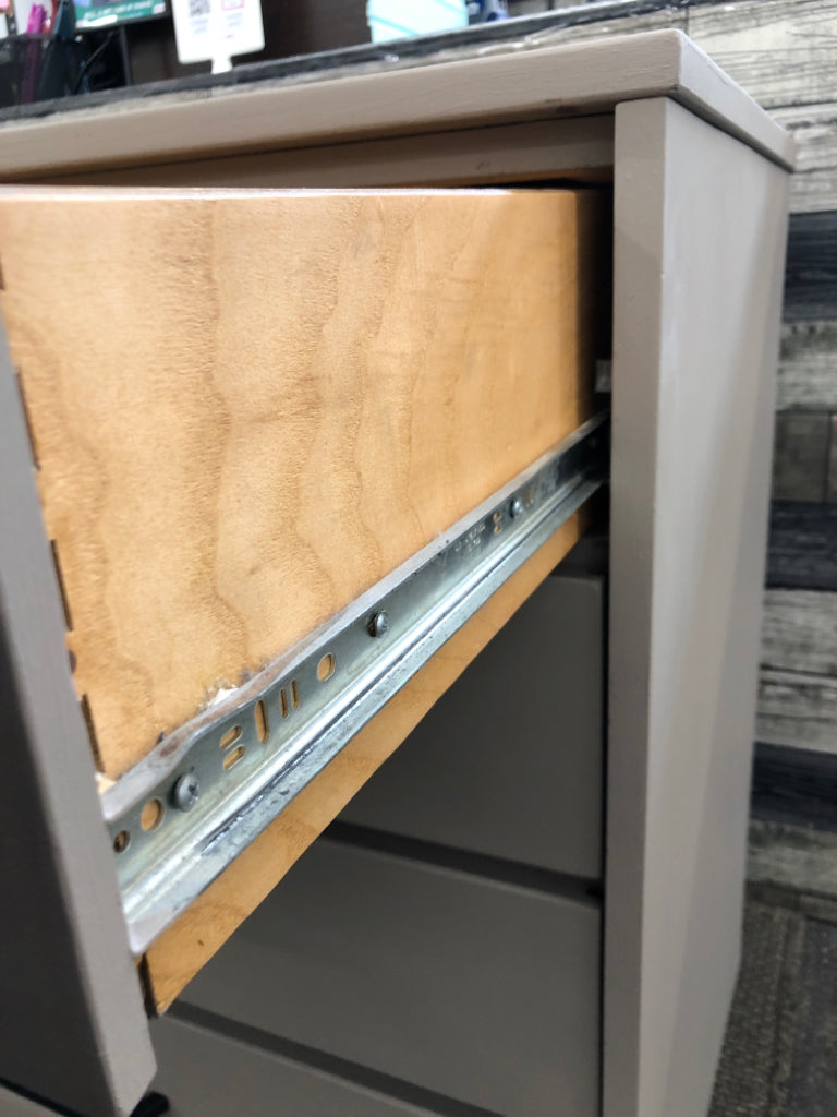 4-DRAWER BEIGE DRESSER.