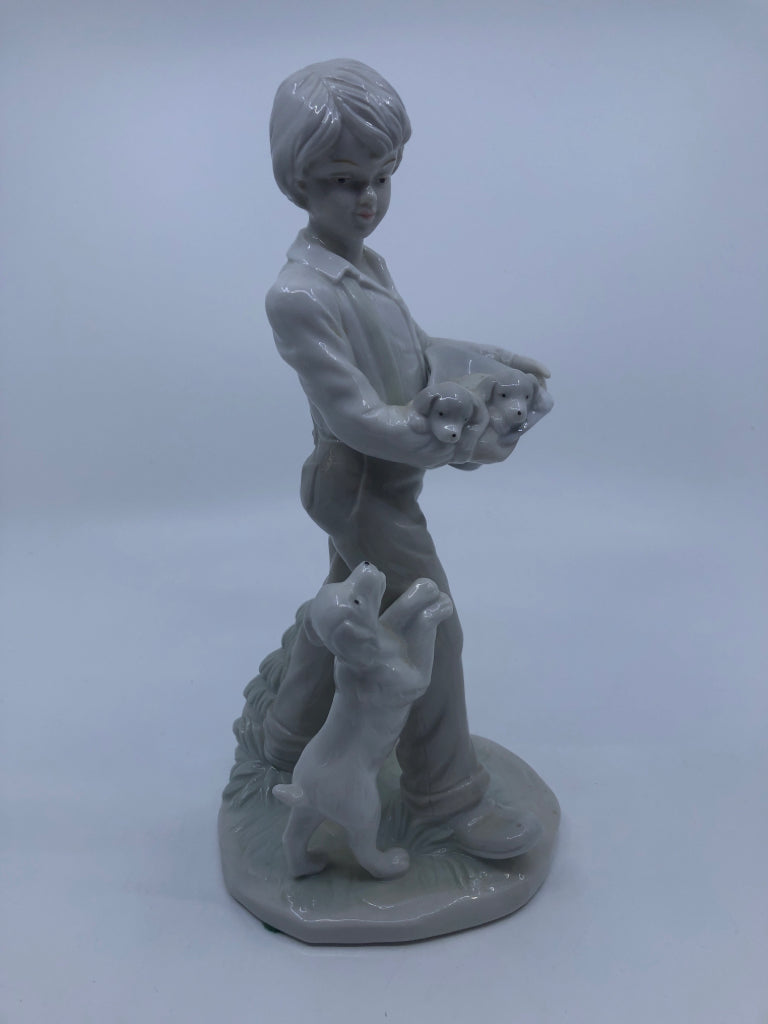 BOY W/DOGS PORCELAIN FIGURINE.