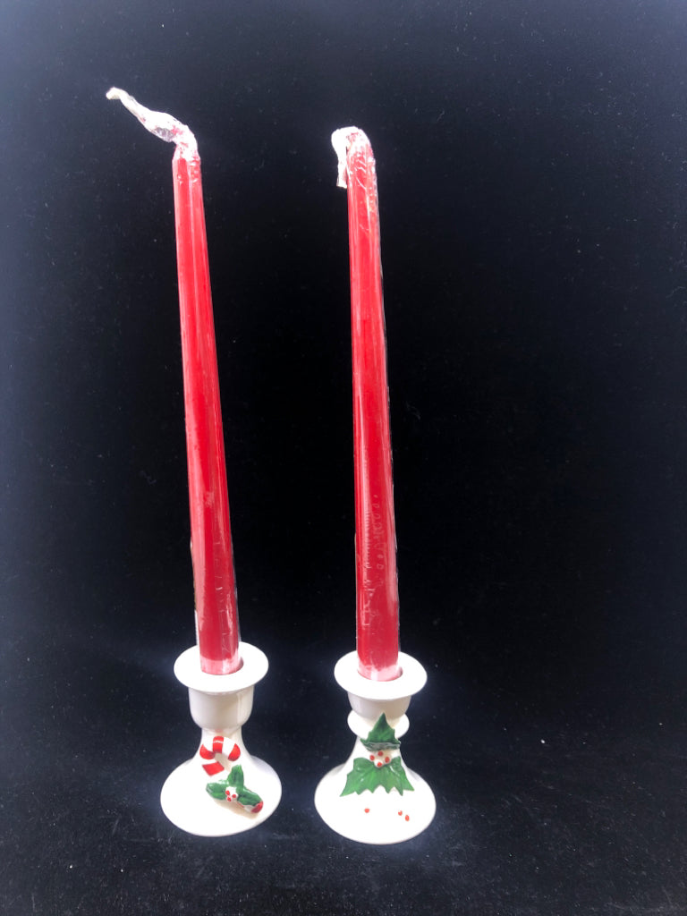 2 WHITE TAPER CANDLE HOLDERS-HOLLY & CANDY CANE WITH RED TAPER CANDLES.