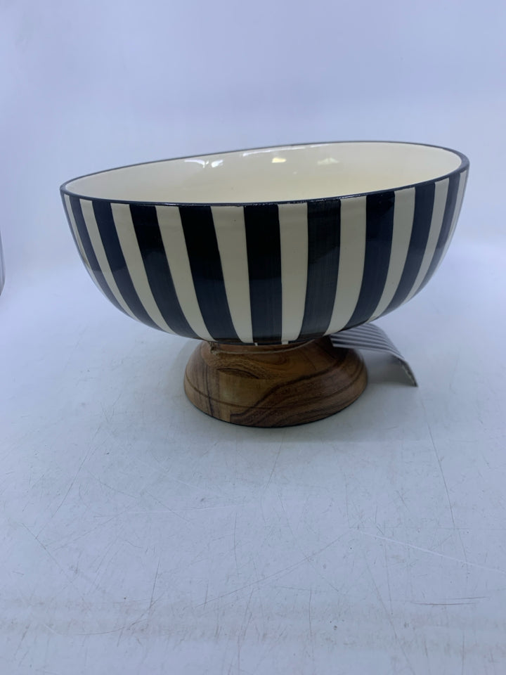 WOOD FOOTED BASE W/ BLACK/WHITE STRIPED CERAMIC BOWL.