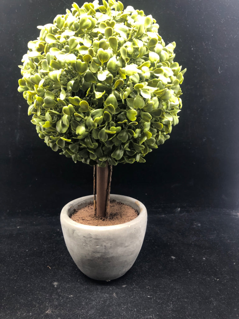 FAUX SHRUB CIRCLE TREE IN GRAY CEMENT PLANTER.