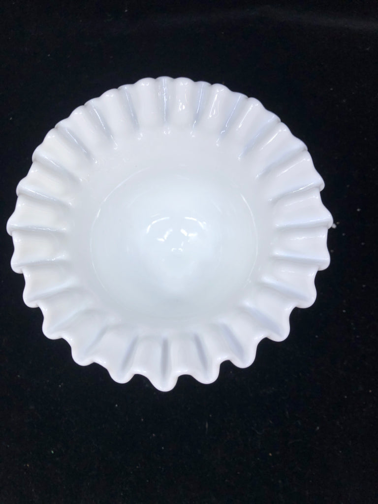 FOOTED MILK GLASS CANDY DISH W RUFFLED EDGES.