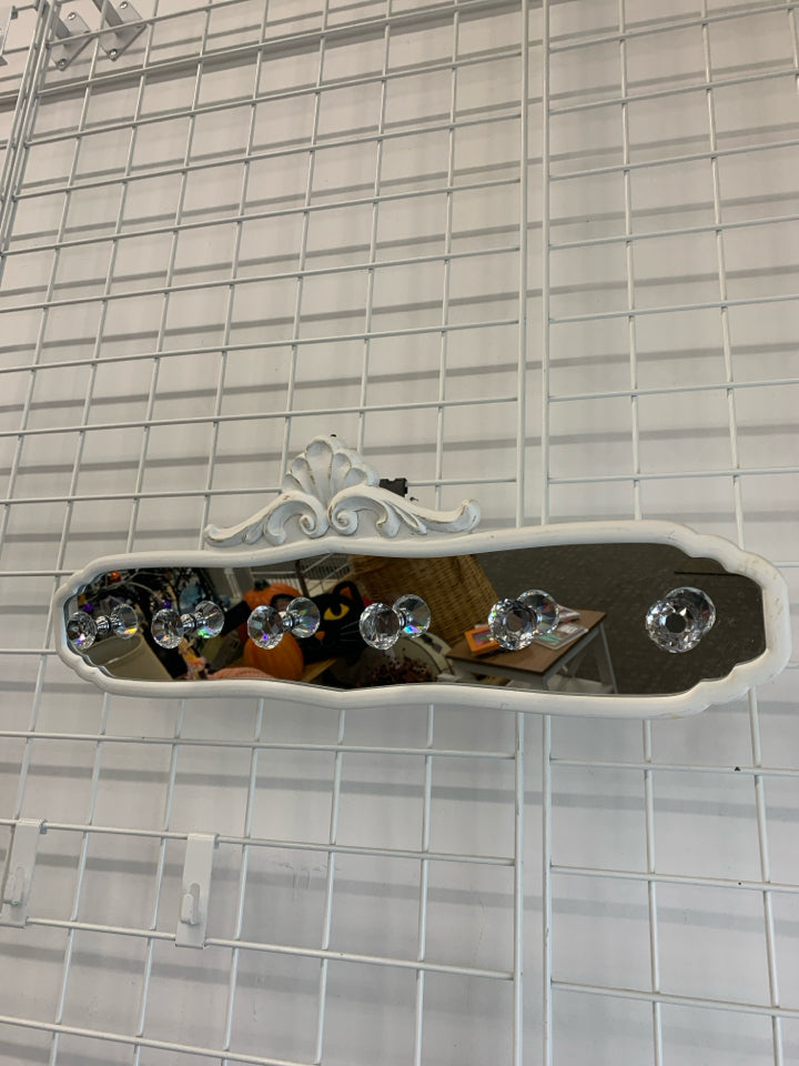 MIRRORED WALL HOOKS.