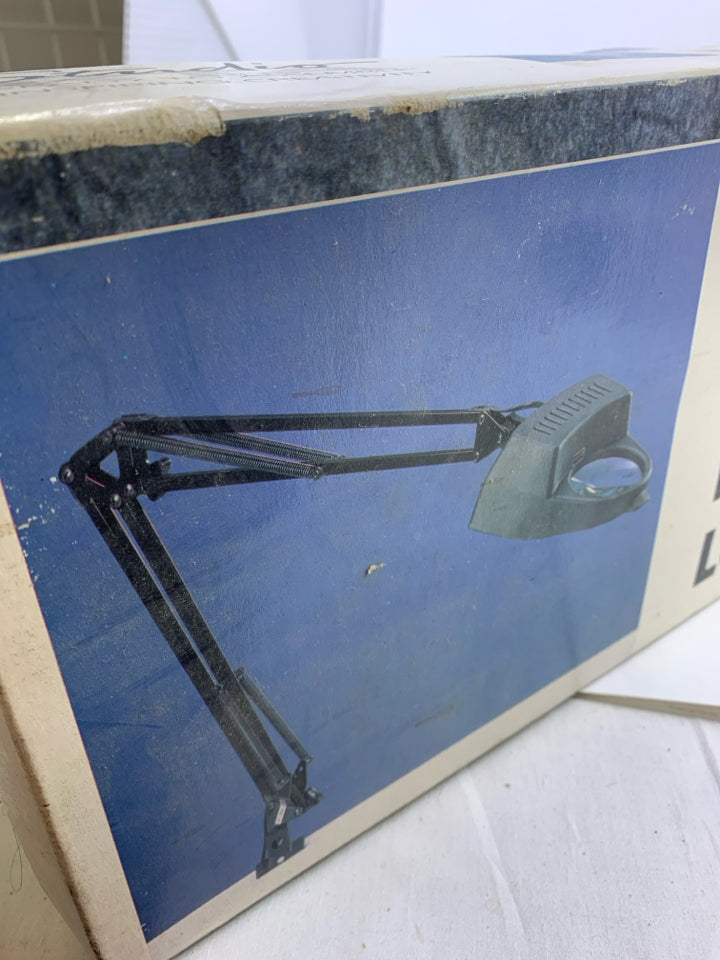 NIB CLAMP ON MAGINFYING LAMP.