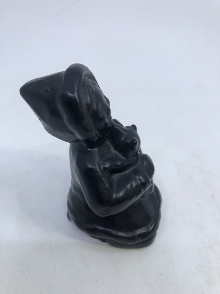 GIRL IN SNOW-COAT HUGGING ANIMAL HAND CARVING COLUMBIA COAST ARTWARE.