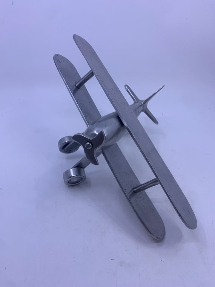 MATTE SILVER METAL AIRPLANE W/ MOVABLE WINGS.