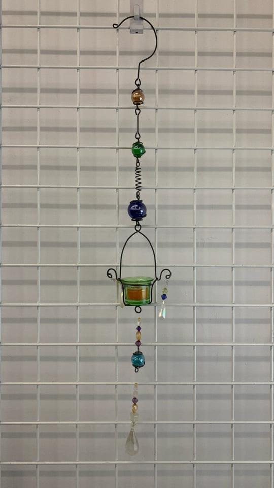METAL+GLASS BEADED VOTIVE HOLDER W/ORANGE SCENTED CANDLE.