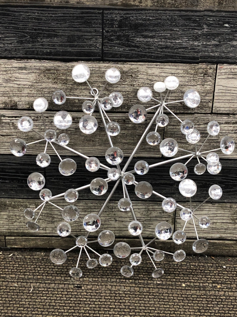 SILVER METAL STARBURST W/CRYSTAL EMBELLISHMENTS.