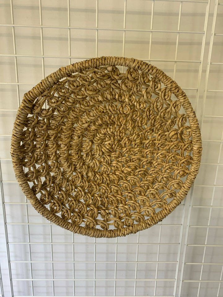 WOVEN CIRCLE BASKET WALL ART.