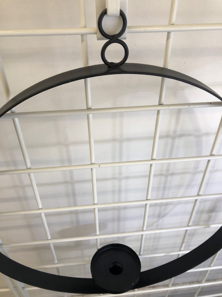 BLACK METAL RING CANDLESTICK HOLDER WALL HANGING.