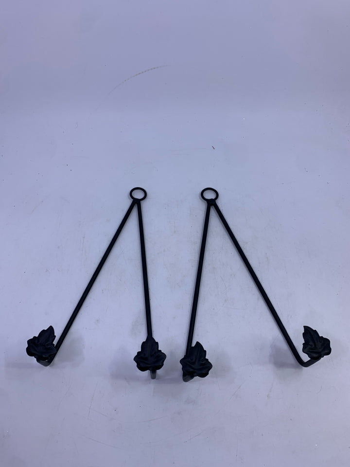 2 BLACK IRON HANGING PLATE HOLDERS W/ LEAVES.