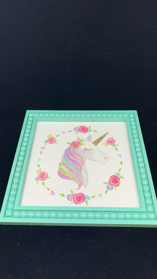 GLITTER UNICORN IN TEAL FRAME.