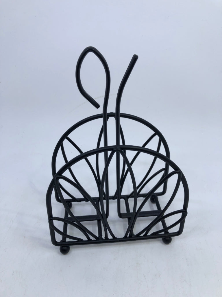 BLACK METAL CUTOUT NAPKIN HOLDER.