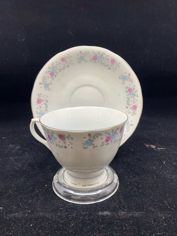 PINK AND BLUE FLORAL TEA CUP AND SAUCER.