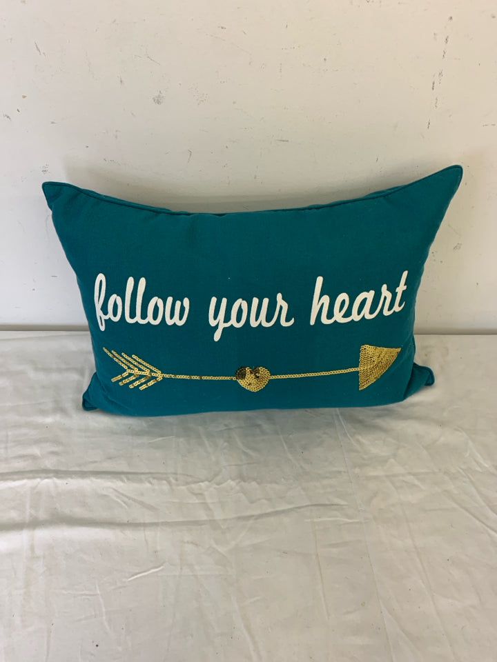 FOLLOW YOUR HEART TEAL PILLOW W/GOLD ARROW.