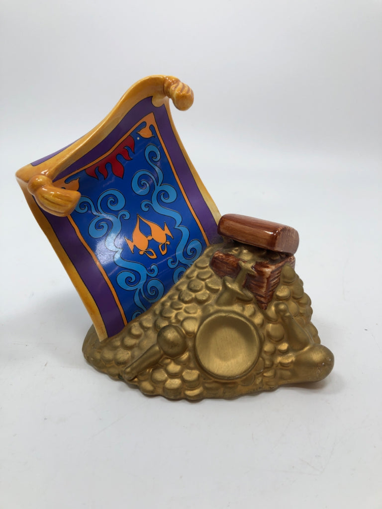 CERAMIC ALADDIN CARPET FIGURINE.