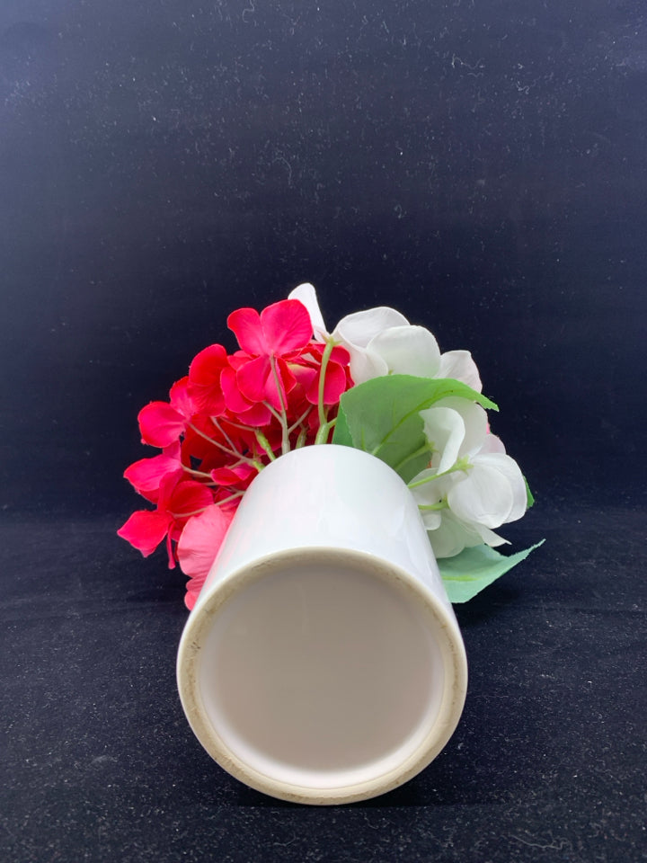 FAUX PINK FLORAL IN WHITE VASE.