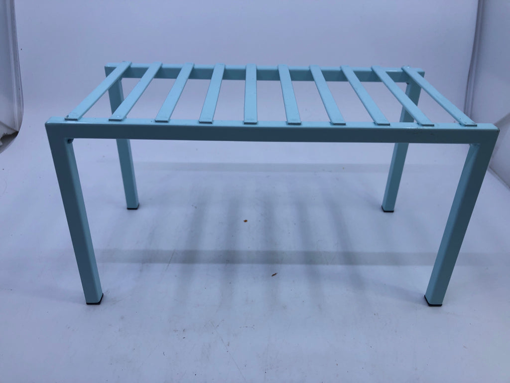 LIGHT BLUE CABINET STORAGE RISER.