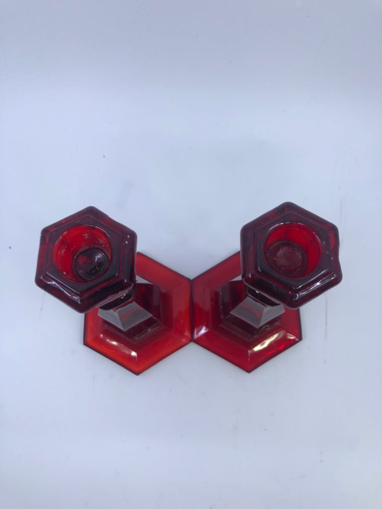 2 RED GLASS TAPER CANDLE HOLDERS.