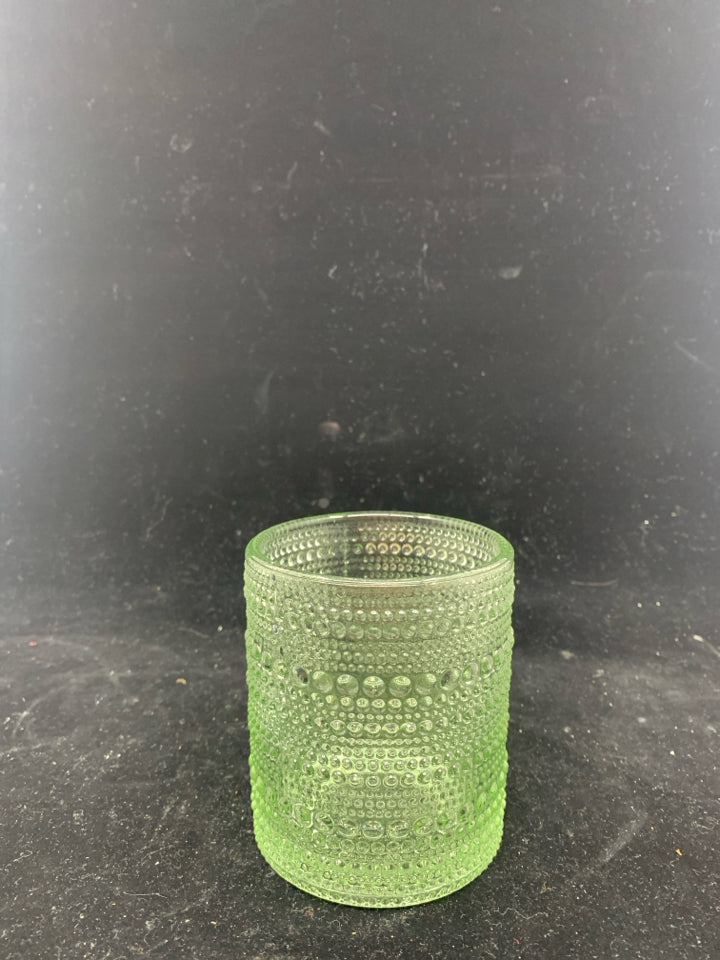 GREEN TINTED TEXTURED GLASS CANDLE HOLDER.