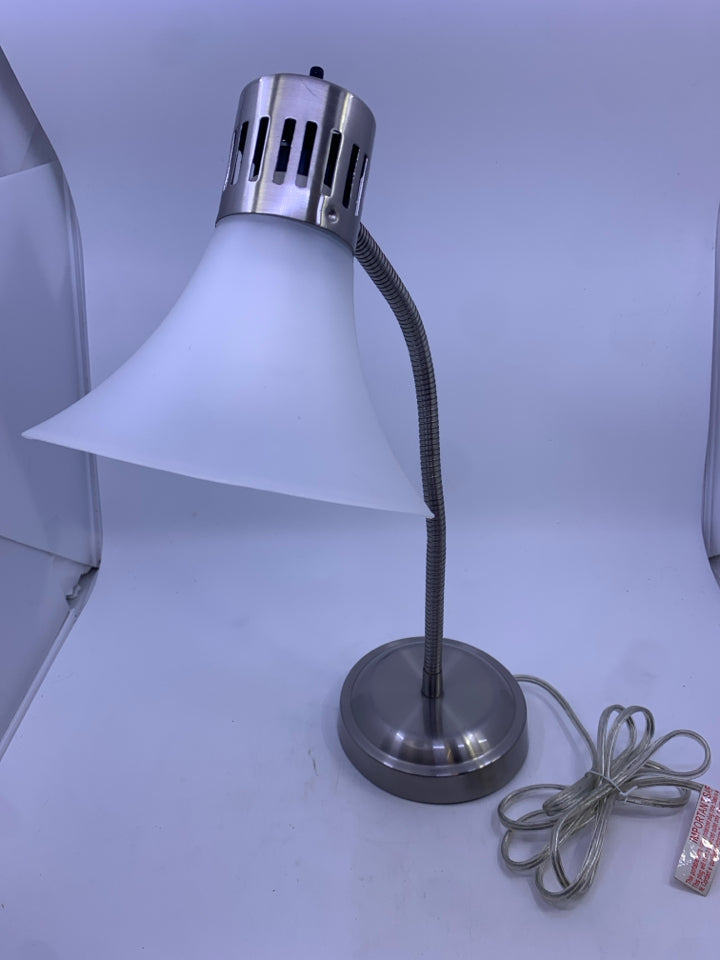 SILVER ADJUSTABLE LAMP W CLEAR PLASTIC SHADE.