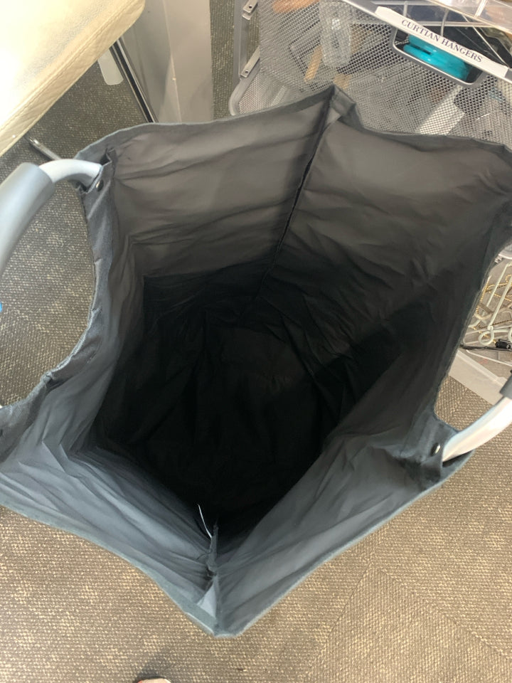 BLACK CANVAS LAUNDRY BAG W/METAL HANDLES.