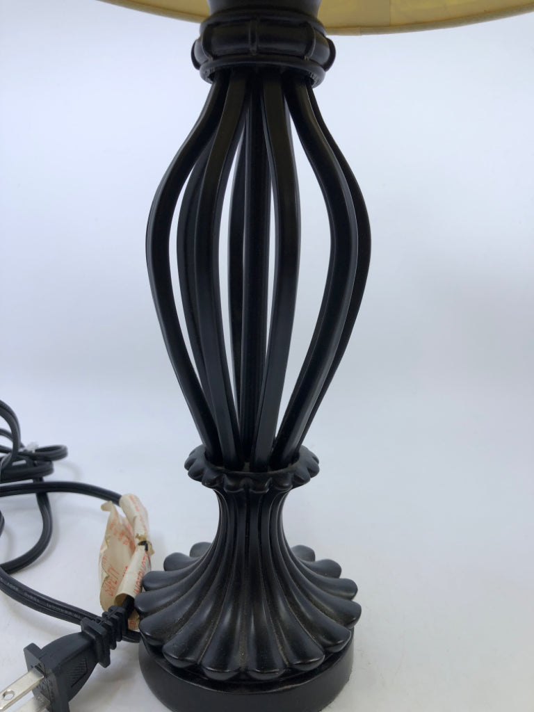 BLACK SCROLL BASE LAMP W/CREAM TEXTURED SHADE.