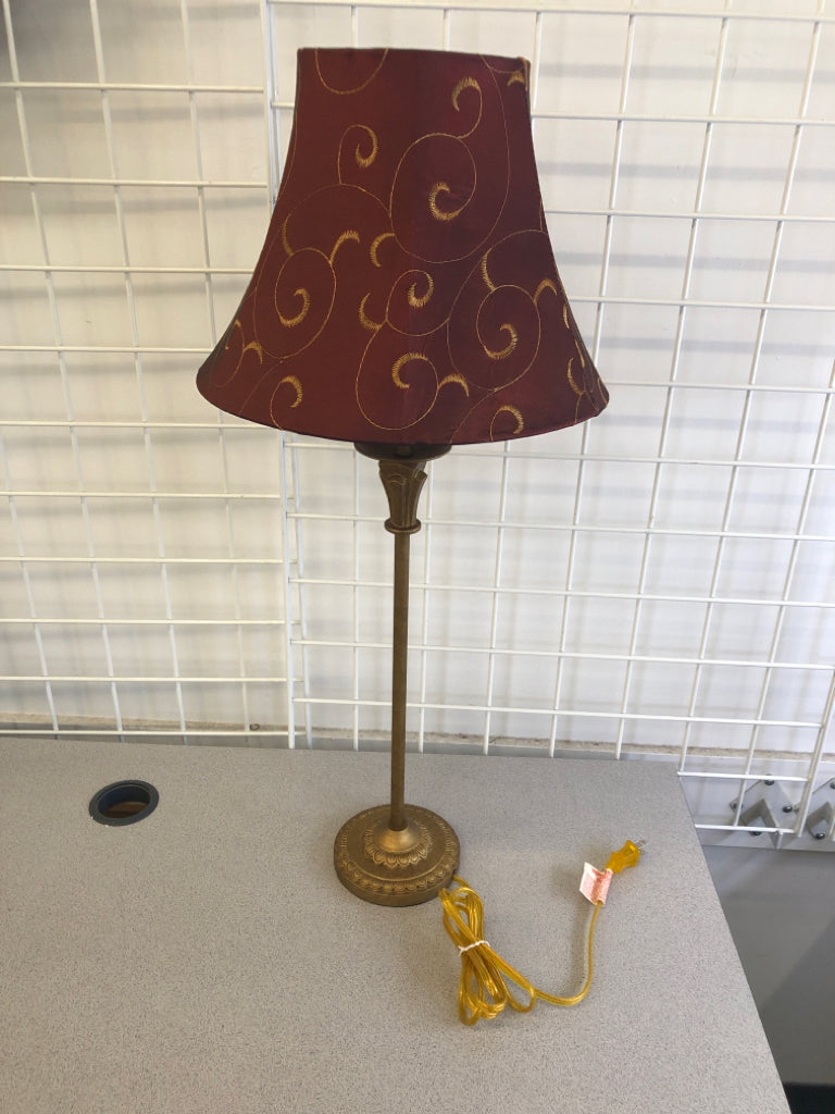 GOLD SKINNY BASE LAMP W MAROON AND GOLD ACCENTS SHADE.