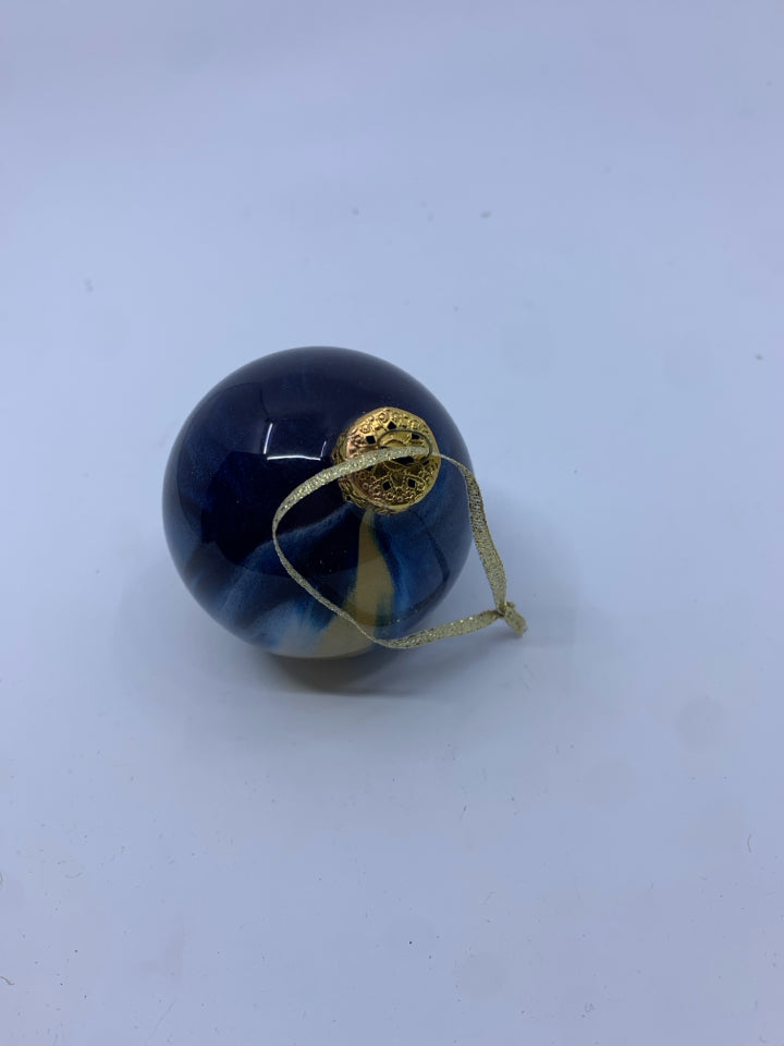 BLUE AND GOLD STRIPED BULB ORNAMENT.