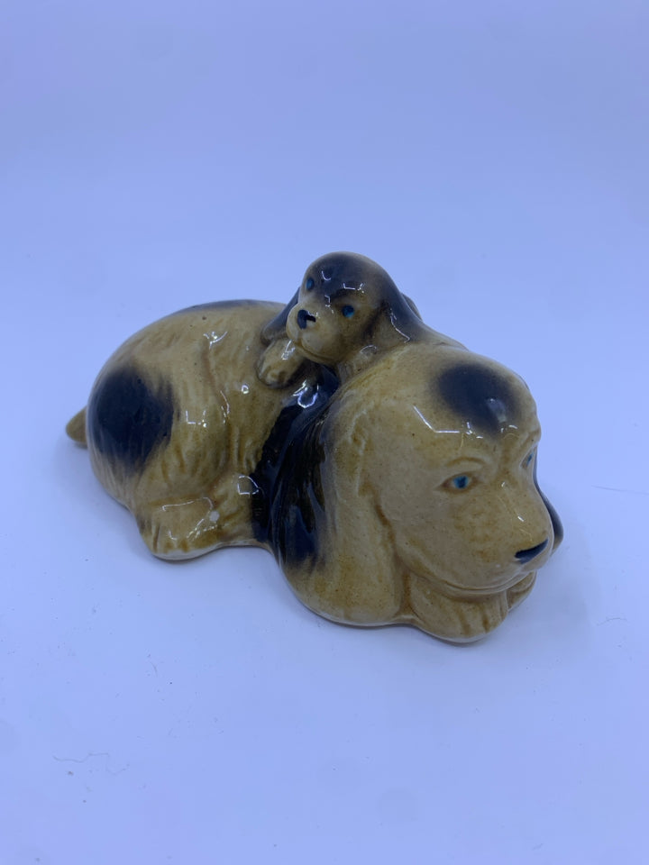 CERAMIC SLEEPING DOG FIGURE.