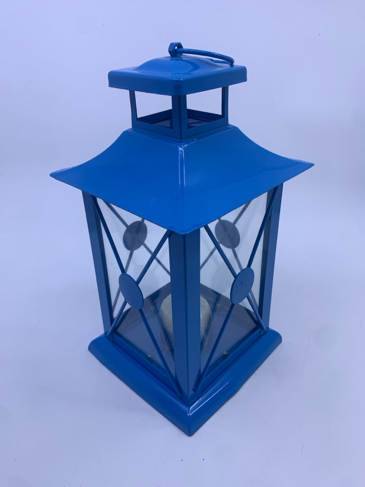 BLUE METAL TEA LIGHT LANTERN.