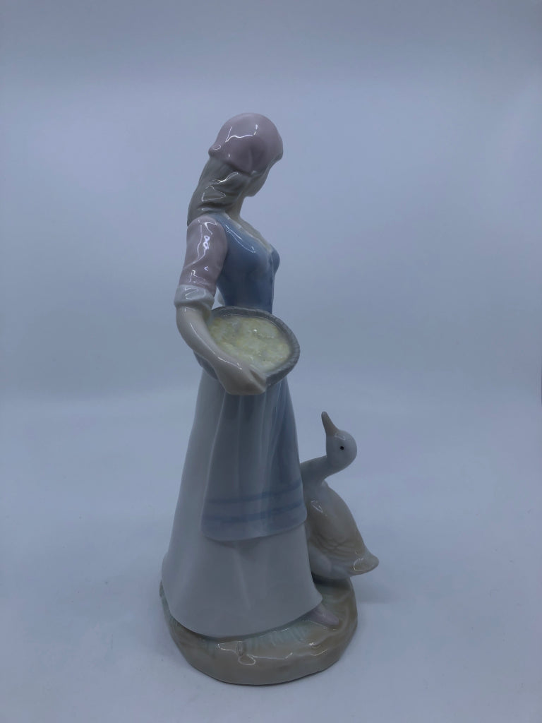 GIRL FEEDING GEESE PORCELAIN FIGURINE.