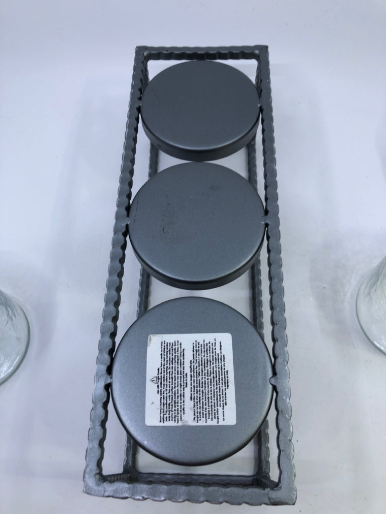 3 CANDLE HOLDERS IN METAL HOLDER.
