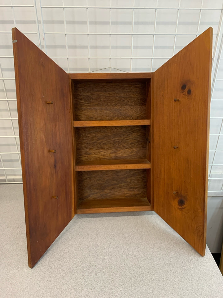 WOODEN WALL-SHELF W/ANGLED DOORS & HOOKS.