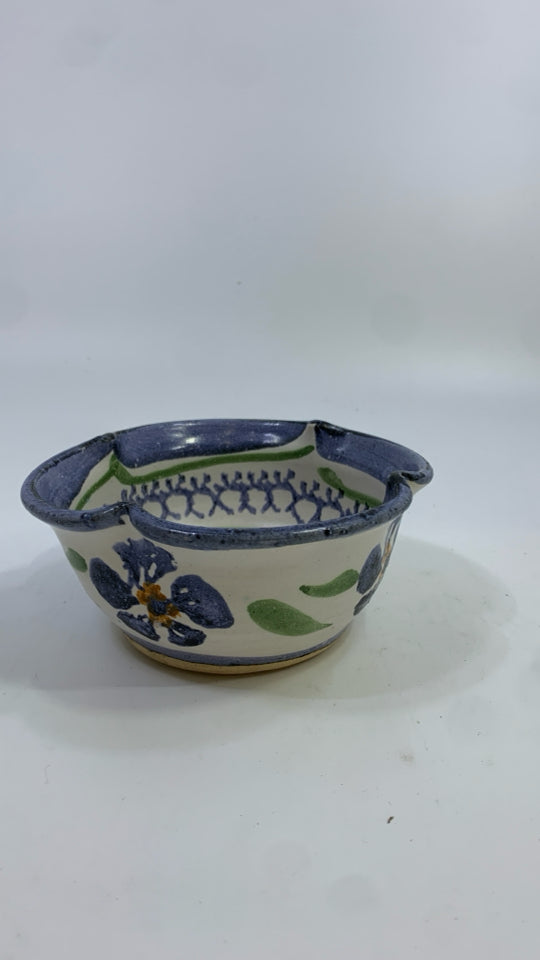 SMALL POTTERY BOWL W/BLUE FLOWERS.