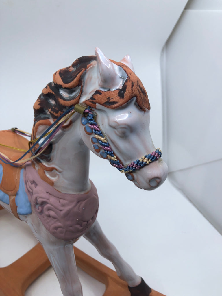 TERRACOTTA PAINTED ROCKING HORSE.