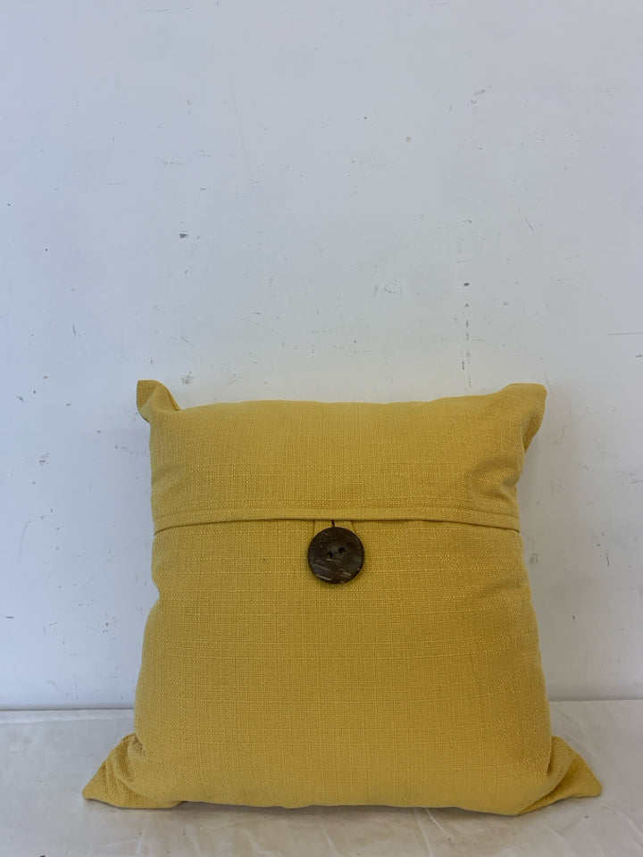 MUSTARD YELLOW PILLOW W/ BUTTON.