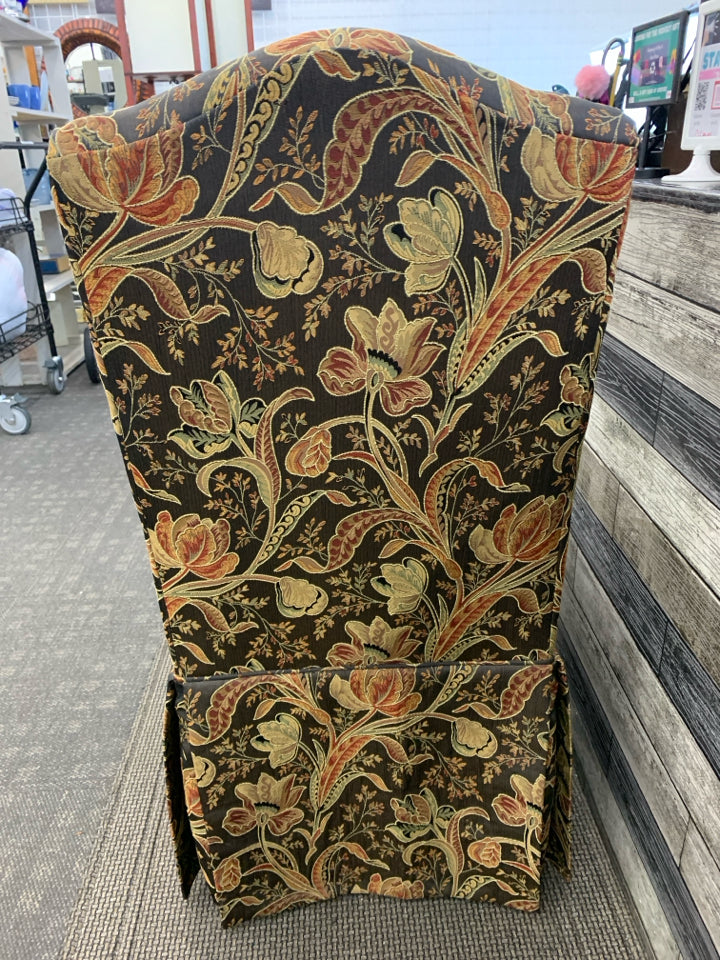 BLACK FLORAL UPHOLSTERED SLIPPER CHAIR.