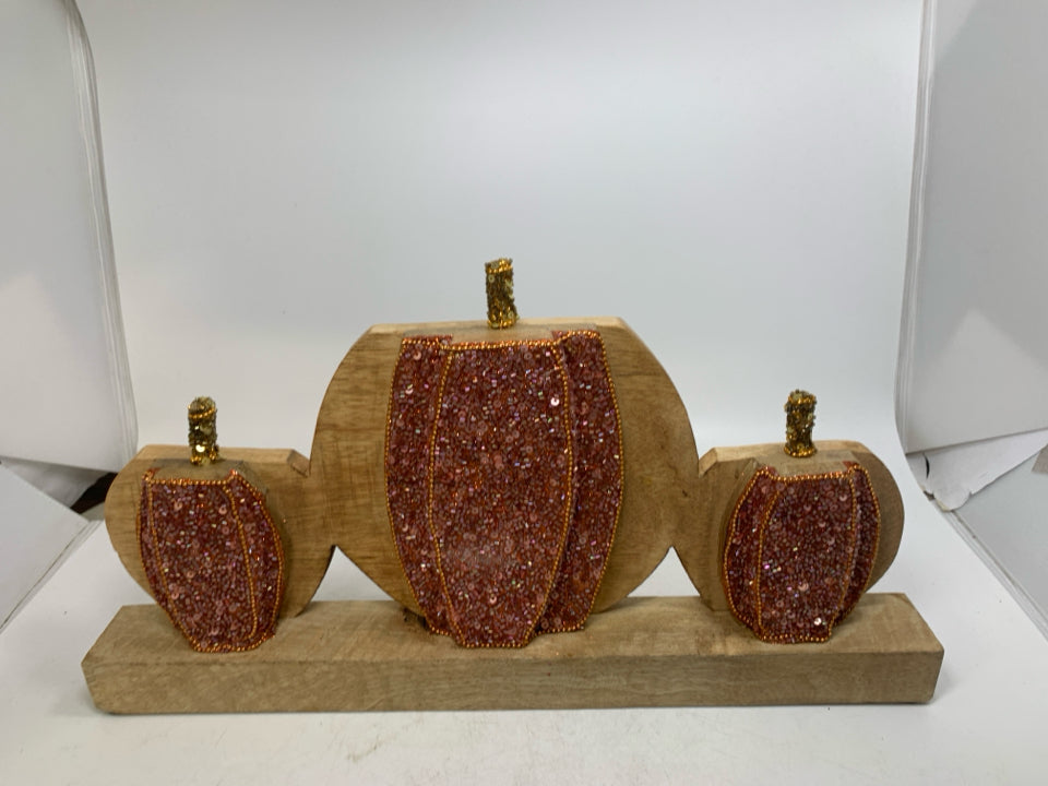 3 PINK SEQUENCE WOOD PUMPKINS.