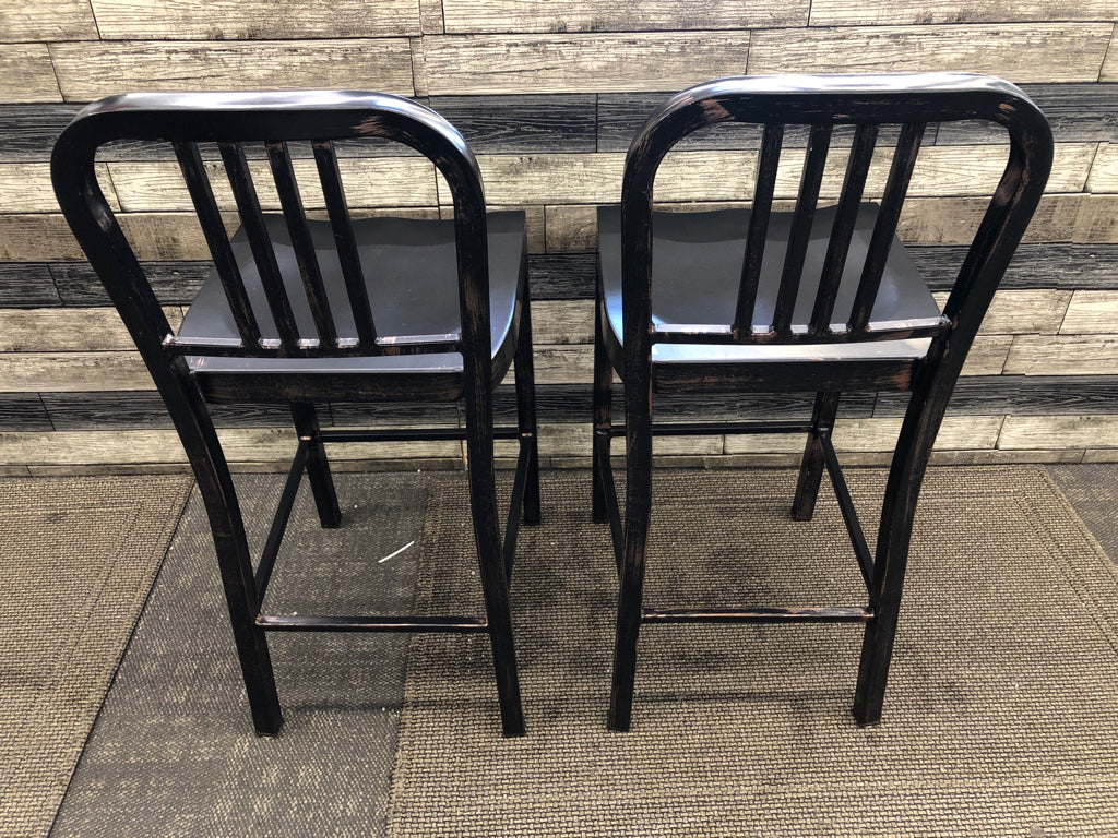 2 BLACK METAL DISTRESSED LOW BACK STOOLS.