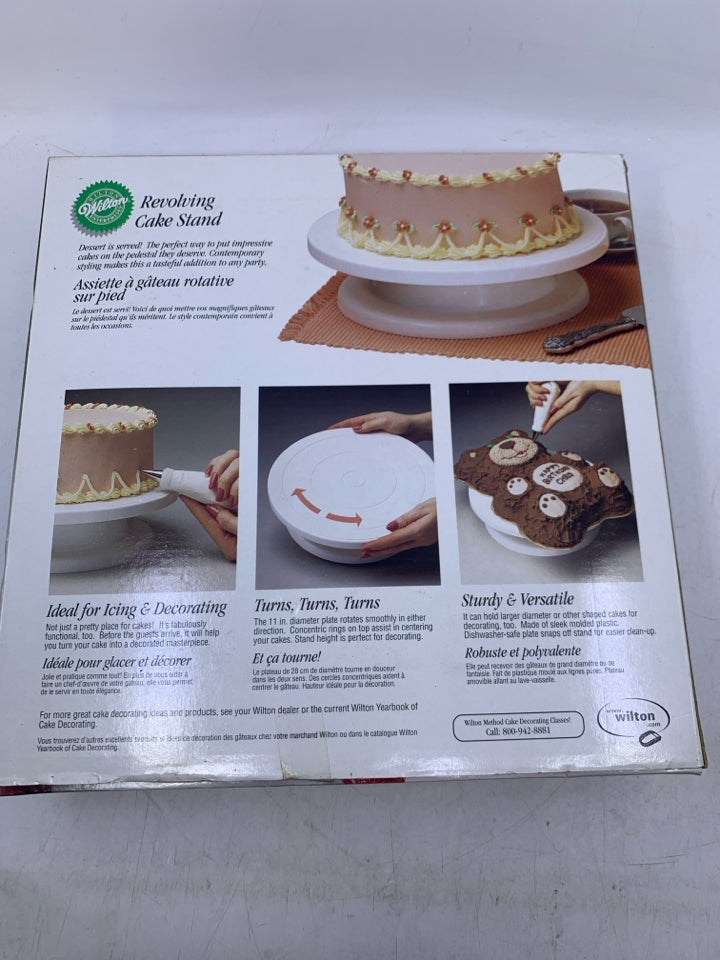 NIB WHITE PLASTIC REVOLVING CAKE STAND.