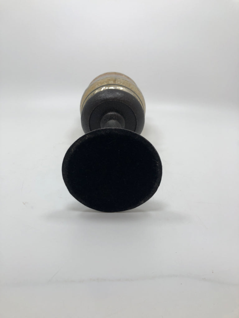 GOLD MERCURY GLASS CANDLE HOLDER ON BROWN METAL BASE.