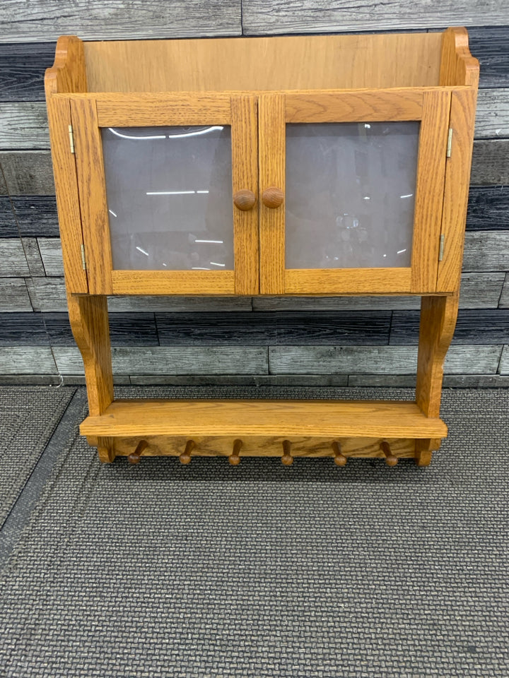 OAK WOOD SHELF W CABINET AND 6 HOOKS.