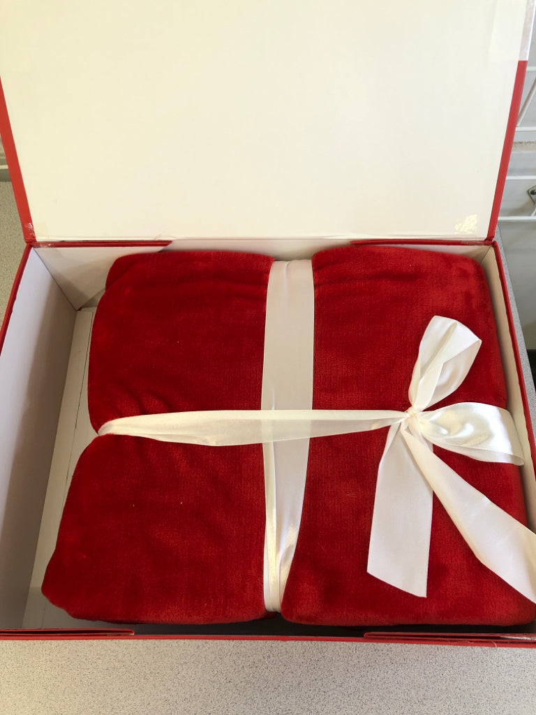 NIB RED BLANKET, IN GIFT BOX WITH WHITE RIBBON.