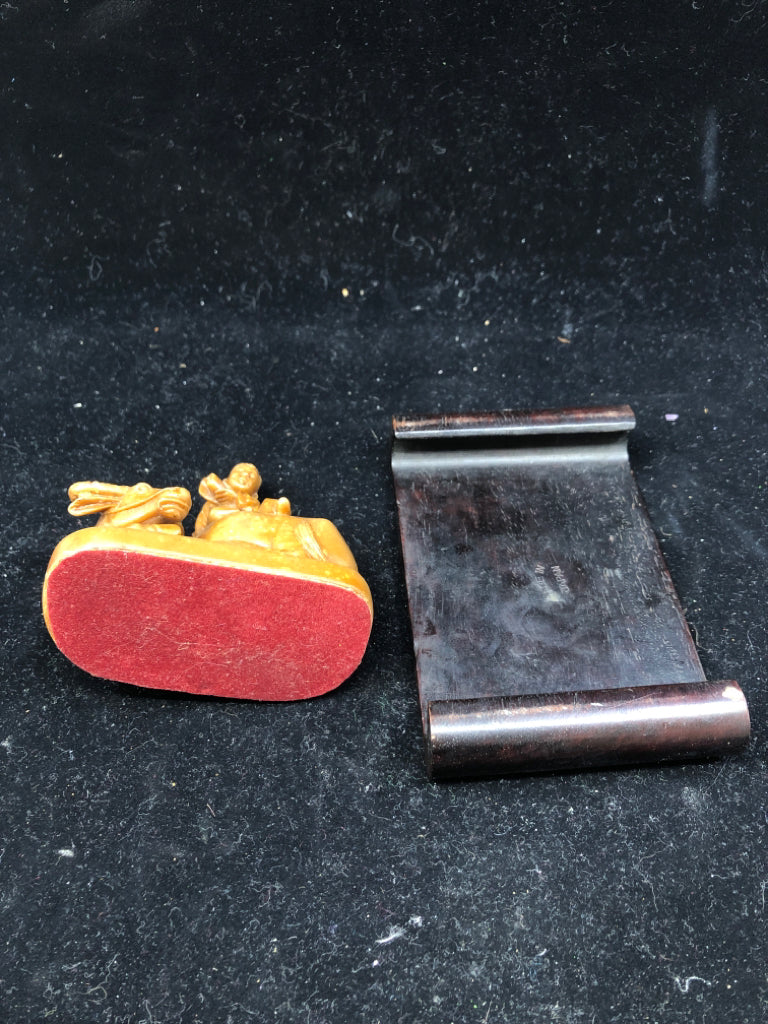 BROWN BULL & MAN FIGURINE ON WOOD SLAB.