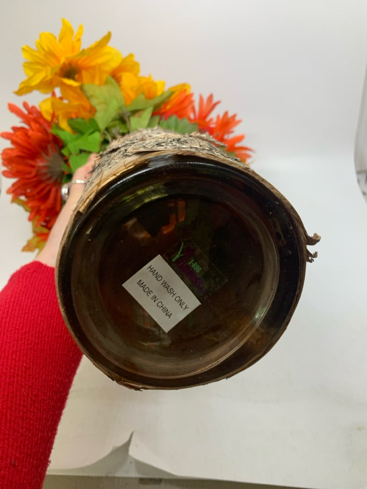 BARK WRAPPED VASE W/ FALL COLORED FLOWERS.
