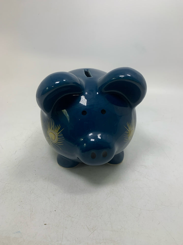 DARK BLUE PIGGY BANK W/ PEACOCK FEATHER DETAILS.