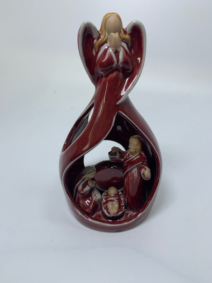 POTTERY DARK RED ANGEL W/ MARY/JOSEPH INSIDE TEA LIGHT HOLDER.