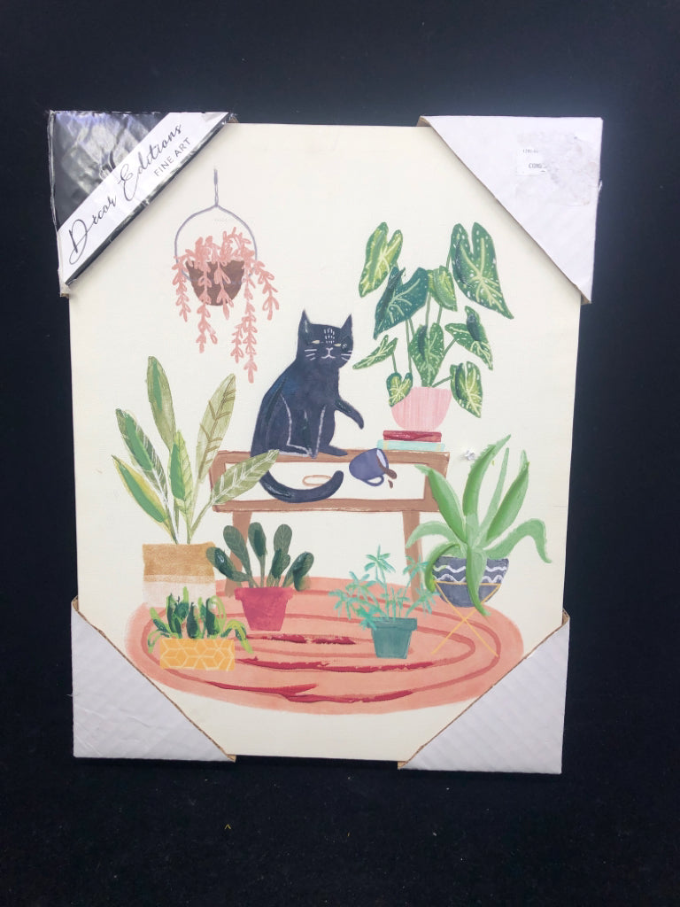 BLACK CAT WALL CANVAS SITTING ON PLANT STAND KNOCKING OVER COFFEE.