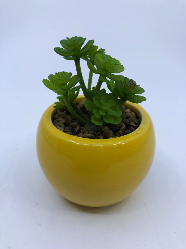 FAUX SUCCULENT IN YELLOW PLANTER.